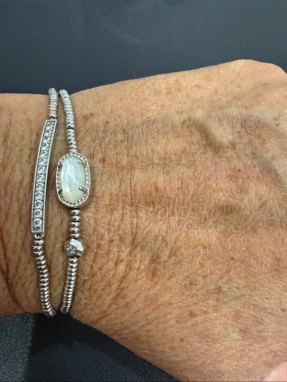 Kendra Scott Silver Opal like Oval Stone & Crystal accent bracelets.